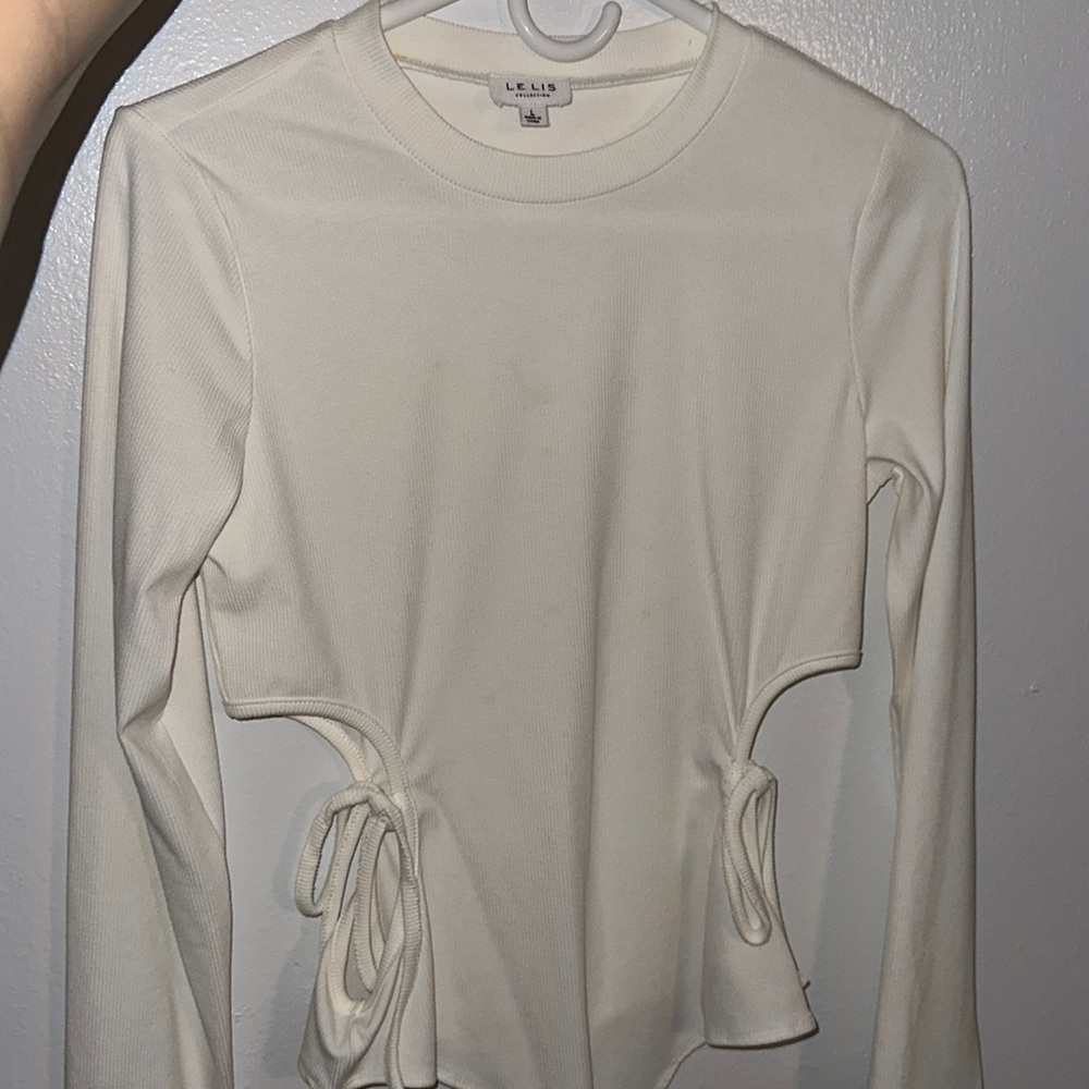 White long sleeve bodysuit with cut outs on the sides